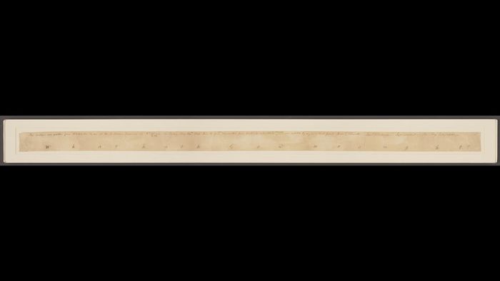 The words ‘what hath God wrought’ written in script beneath a description of the time and place it was sent.