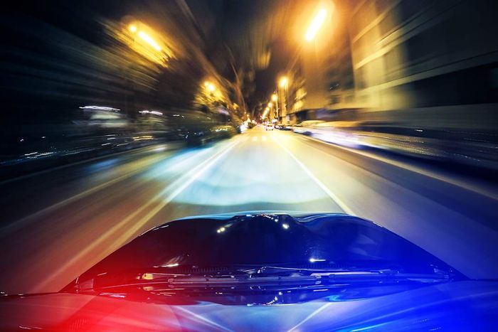 Aerial perspective from a police cruiser during a high-speed pursuit