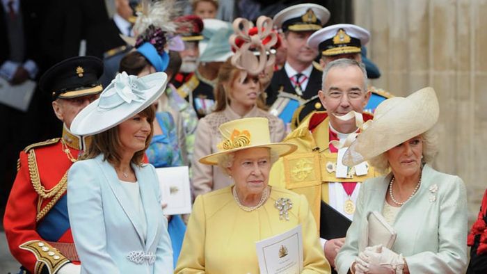 Britain's Queen Elizabeth II (C), Carole Middleton (L) and Camilla, Duchess of Cornwall converse as they exit Westminster Abbey in London after the wedding ceremony of Prince William and Kate, Duchess of Cambridge, on April 29, 2011