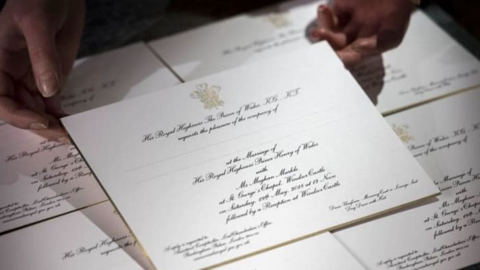 Invitations for the wedding of Britain's Prince Harry and US actress Meghan Markle are displayed, freshly printed at the Barnard and Westwood workshop in London on March 22, 2018