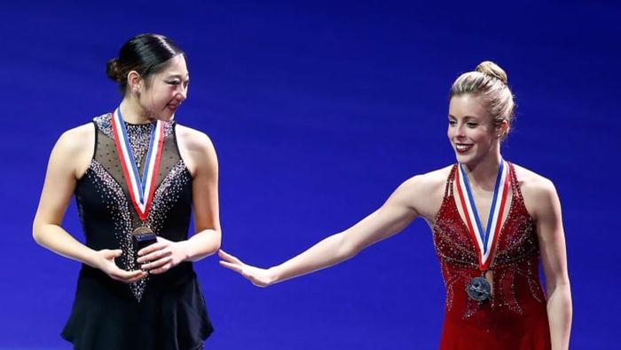 Mirai Nagasu (left) and Ashley Wagner pose on the podium during the medal ceremony after the free skate program at the 2014 Prudential U.S. Figure Skating Championships.