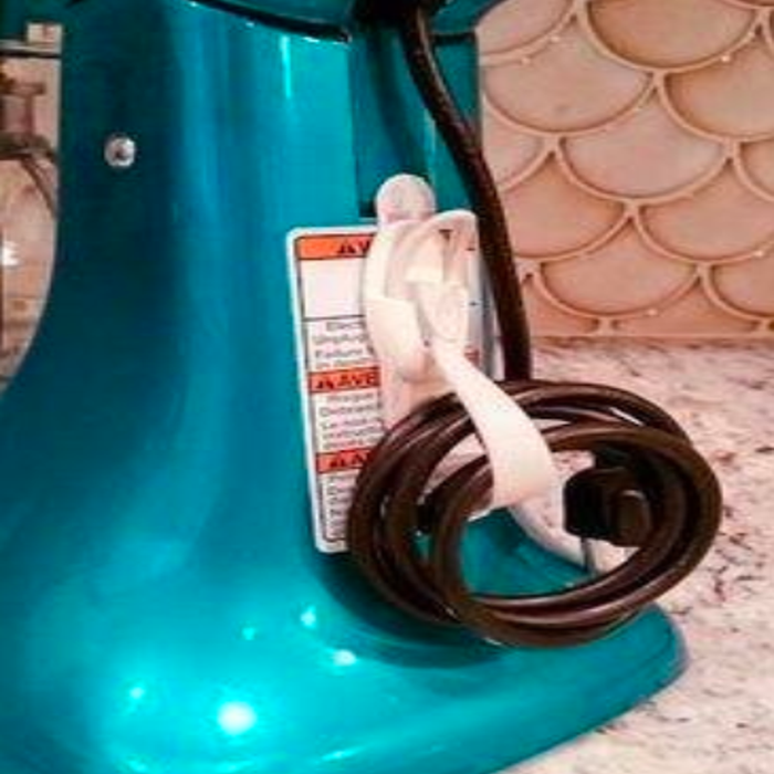The same cord organizer, now attached to the back of a standing mixer to keep things tidy.