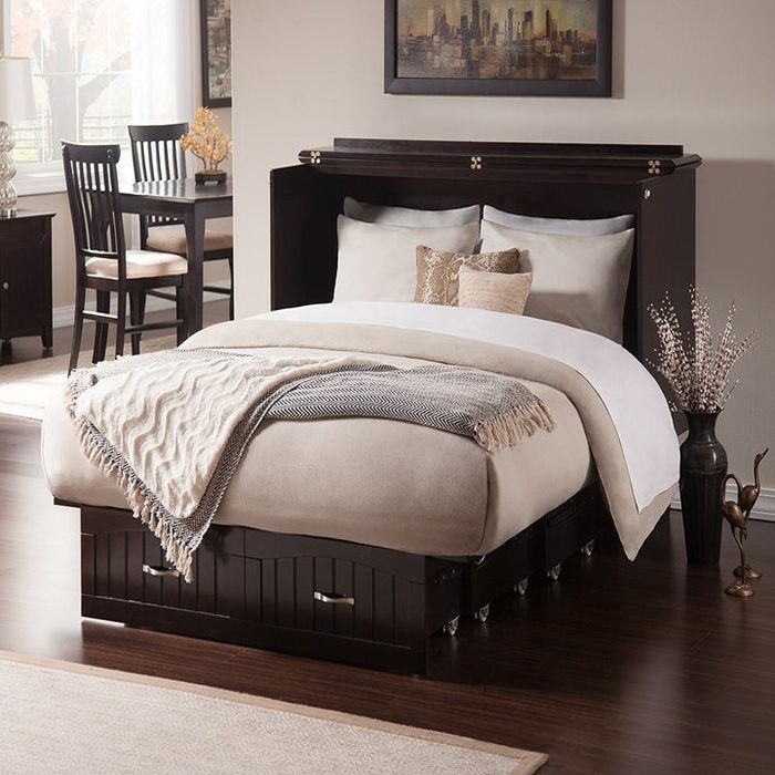 The console opens up to reveal a full Murphy bed inside