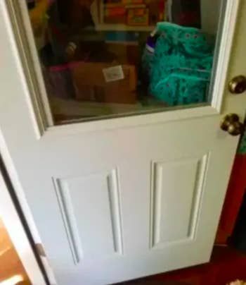 A customer's after photo of the same door, now looking spotless after using the cleaning pads.
