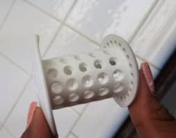 An unused white TubShroom.