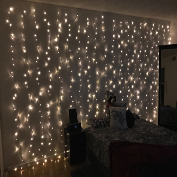 a reviewer's wall adorned with lights cascading down
