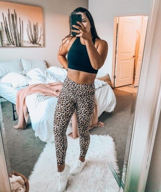 reviewer showcasing leopard print leggings