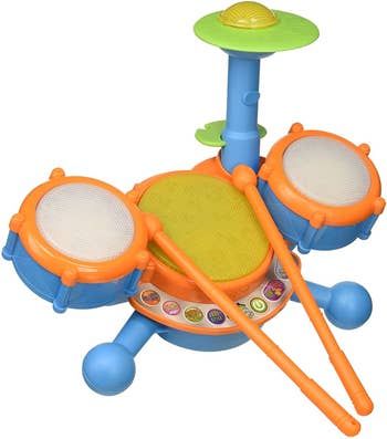 A vibrant blue and orange plastic electronic drum kit complete with drumsticks.