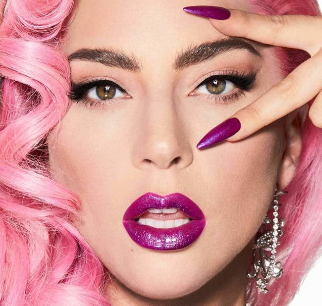 Lady Gaga rocking a vibrant purple tinted lip gloss.