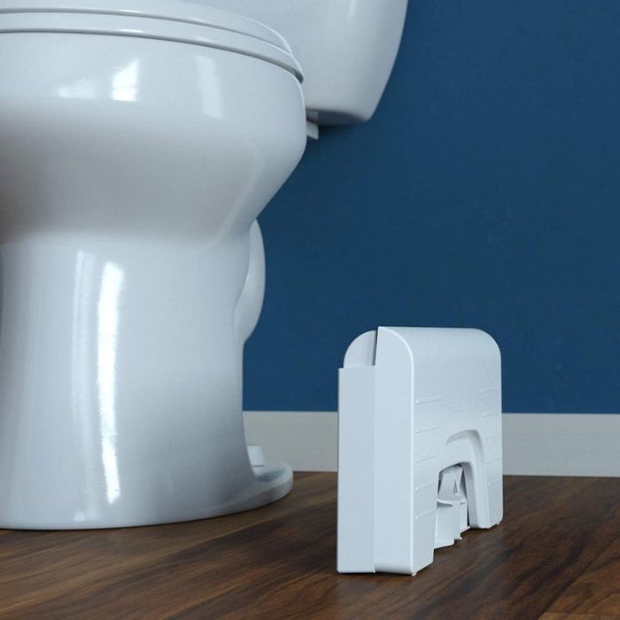 The same stool, neatly folded into a small rectangular shape for convenient storage.