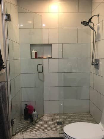 A reviewer's sparkling clean shower with glass doors.