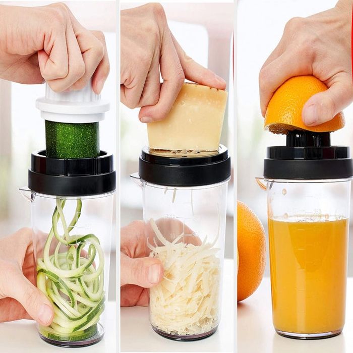 A model demonstrating the device to create zoodles, grate cheese, and squeeze fresh orange juice.