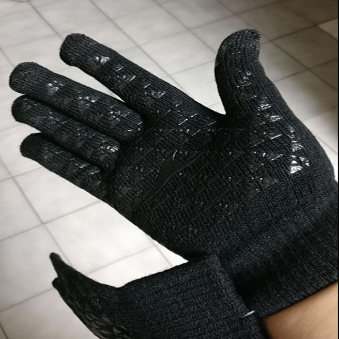 Reviewer wearing black gloves, showcasing the rubber grooves inside the palm for grip and touchscreen use