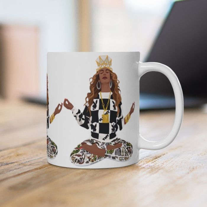 An illustration of Beyoncé on a white coffee mug