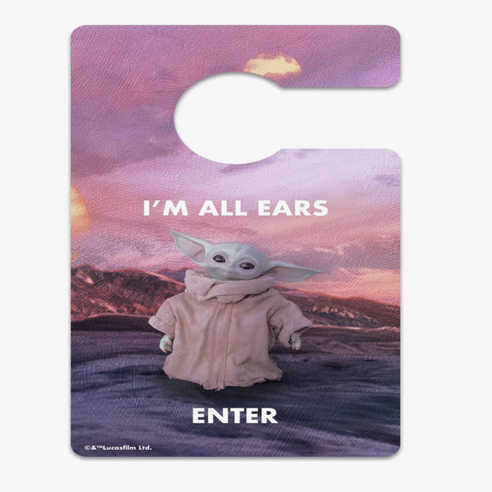 A door sign with Baby Yoda posing adorably, reading