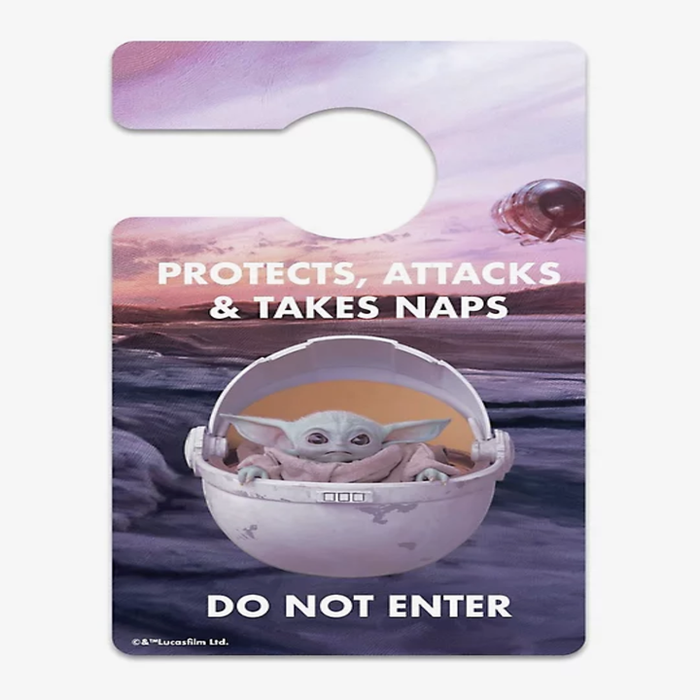 The reverse side shows Baby Yoda in his little carrier with the message