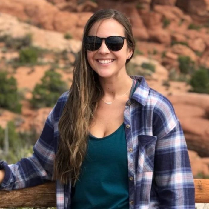 Reviewer showcasing black matte sunglasses