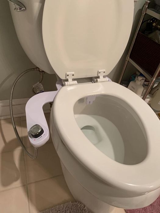 A photo from a reviewer showing the bidet installed on their toilet