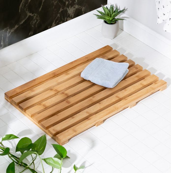 A wood slat bath mat.