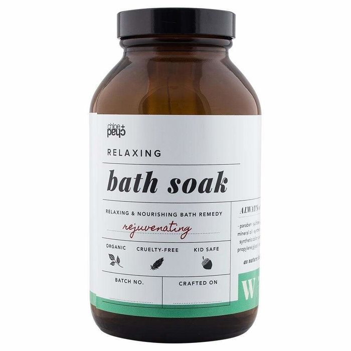 A bottle of luxurious black bath soak for ultimate relaxation.