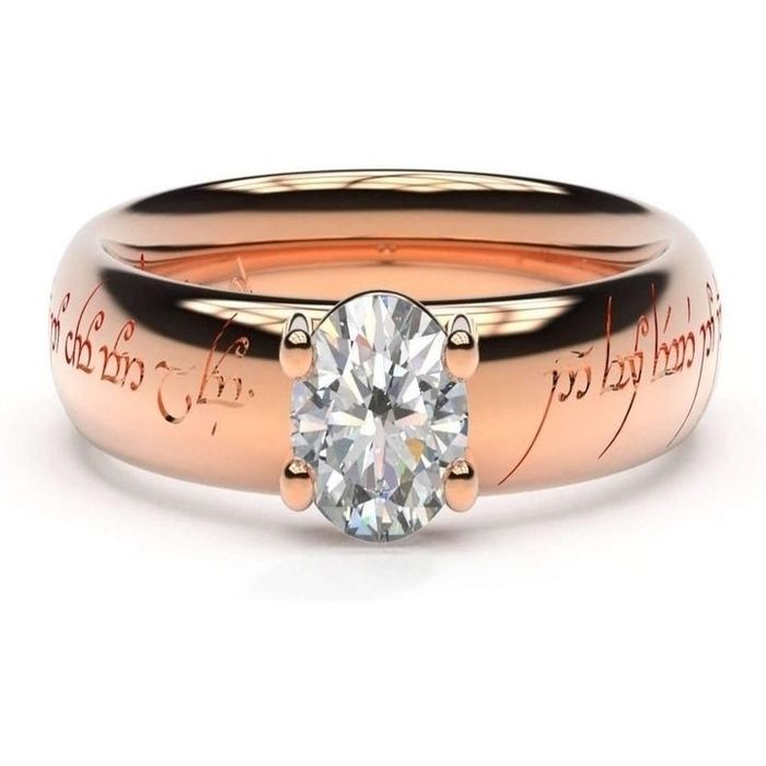 A rose gold band featuring Elvish inscriptions and adorned with a solitary diamond