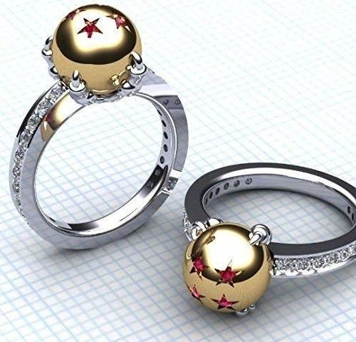 A set of matching rings featuring a diamond-studded band and a gold sphere embellished with ruby stars