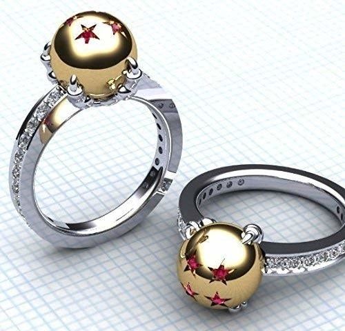 A set of matching rings featuring a diamond-studded band and a gold sphere embellished with ruby stars