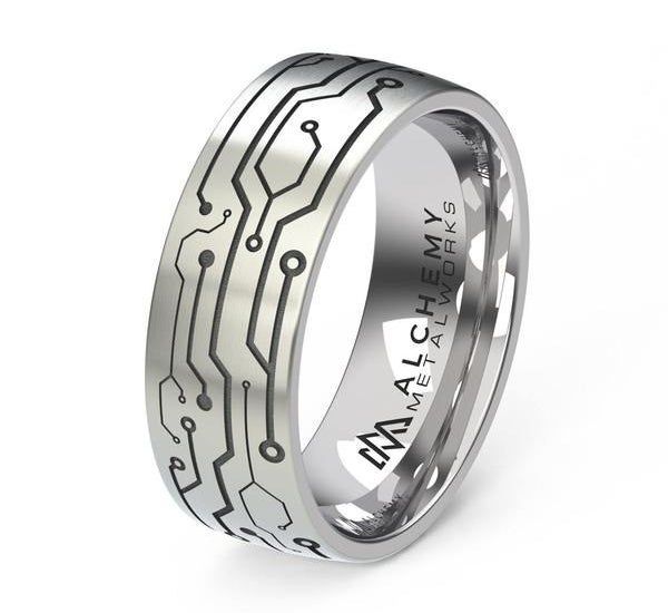 A silver band intricately designed to resemble a circuit board.