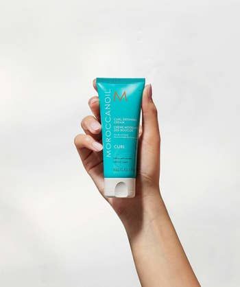 The bottle of curl-enhancing cream