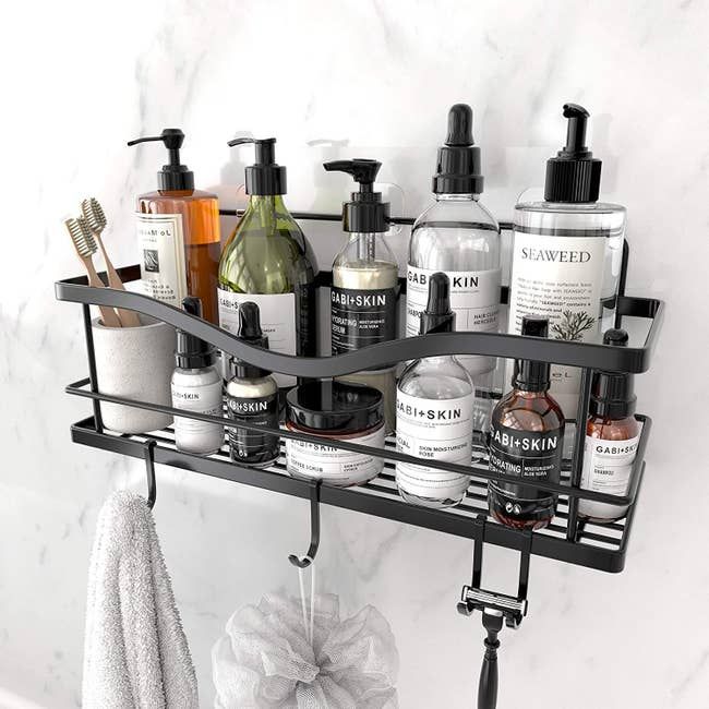 A stainless steel shower basket shelf with hooks, perfect for hanging your bathroom essentials.