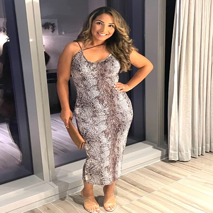 Reviewer showcasing the gray dress