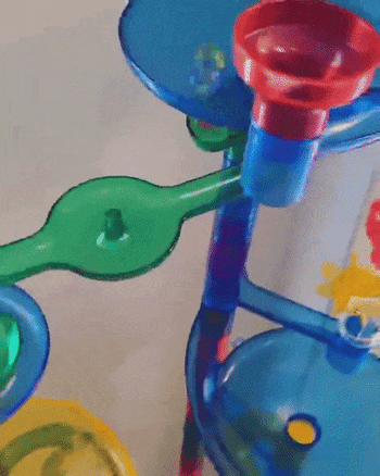 Reviewer demonstrating the marble run set in action