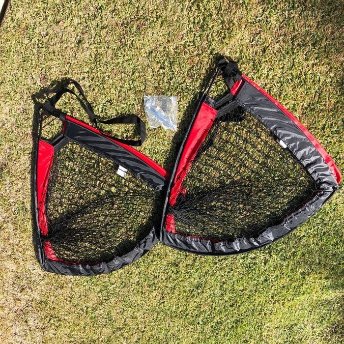 A reviewer's photo displaying two soccer goals neatly folded up.
