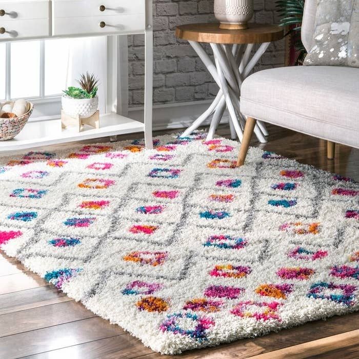 the white and colorful shag rug
