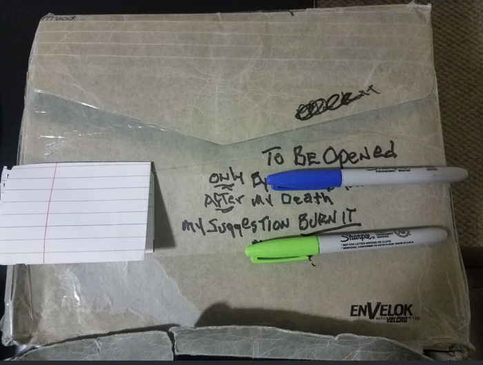 An envelope marked 'To be opened only after my death; my suggestion, burn it'