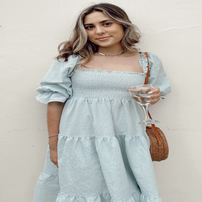 A customer review photo of them wearing the dress.