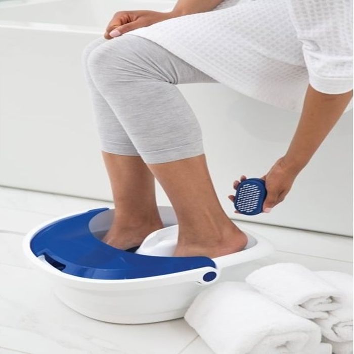 close-up of the model's feet with the brush scrubber in use