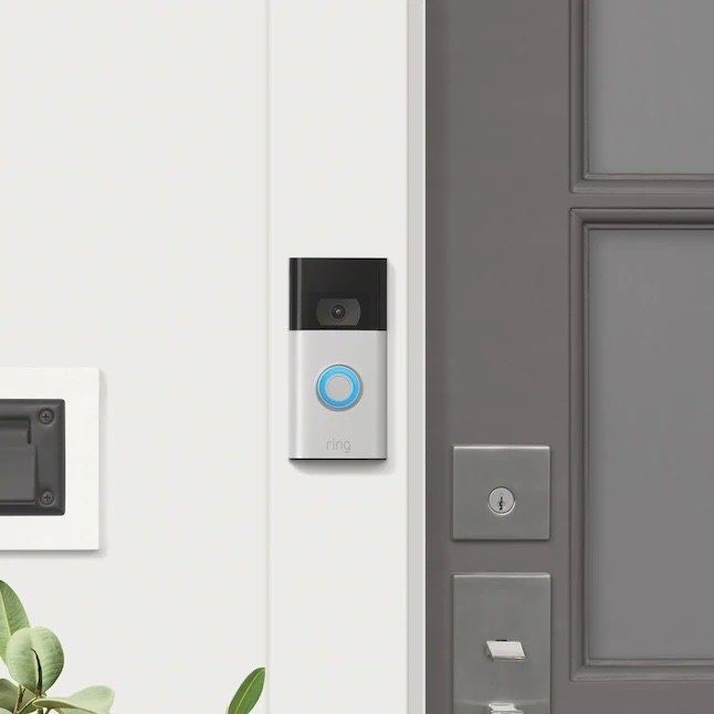 The Ring device installed next to a front door.