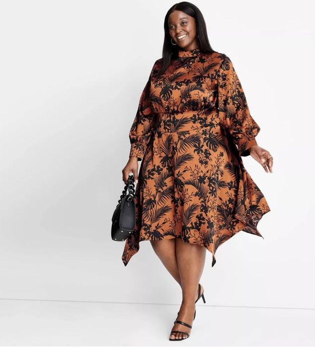 An asymmetrical dress featuring bold orange and black hues for a statement look.