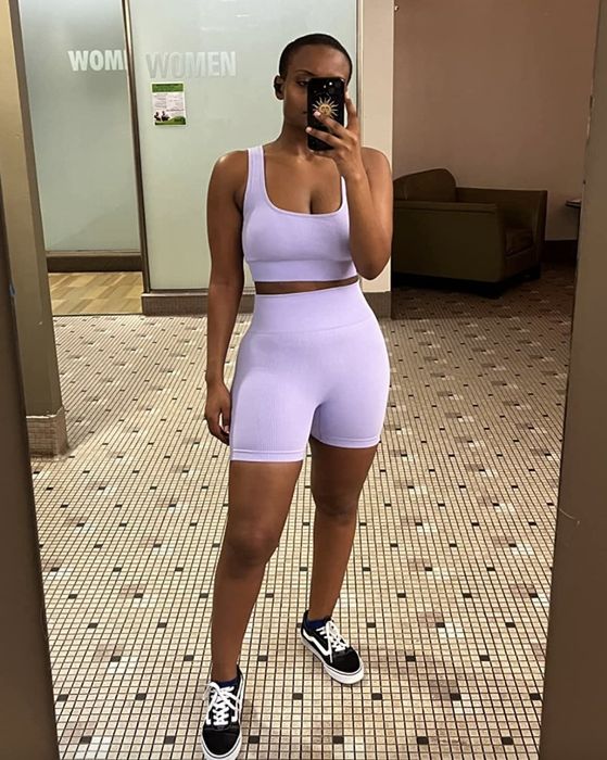 A reviewer wearing the purple set