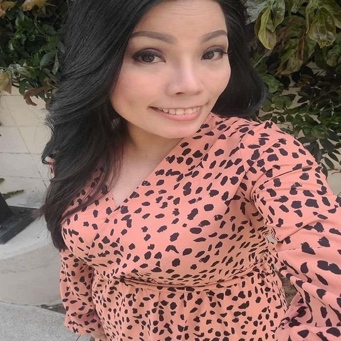 Reviewer modeling the dress in pink