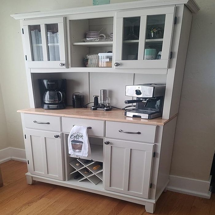 A reviewer’s photo of the elegant white hutch in their living room
