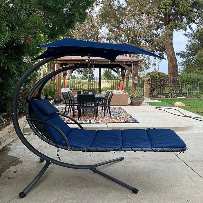 a reviewer’s photo showcasing the navy chaise lounge