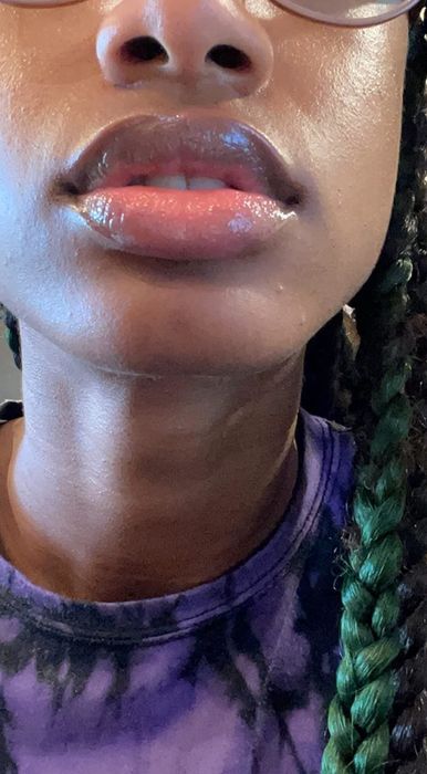 Reviewer applying the lip balm