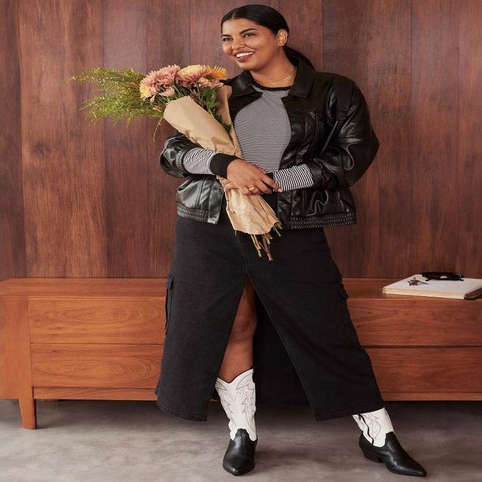 A model showcasing the boots in both black and white