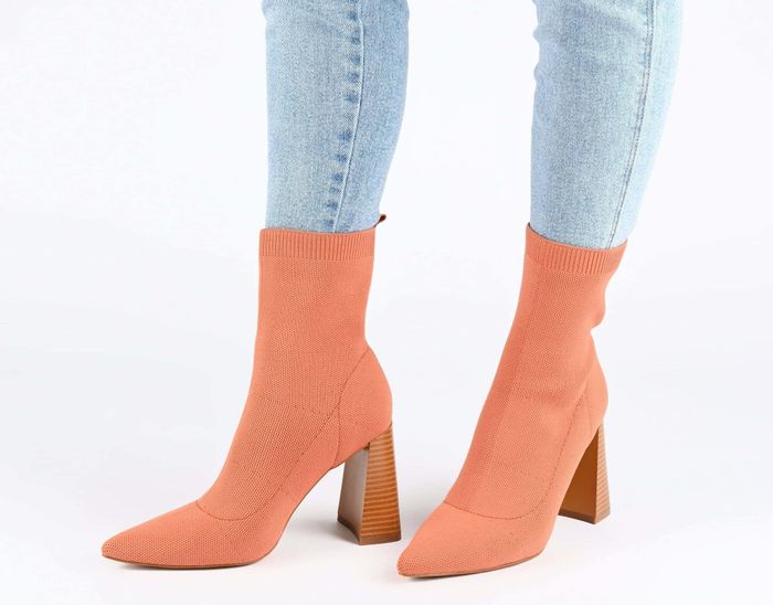 A model wearing the burnt orange boots