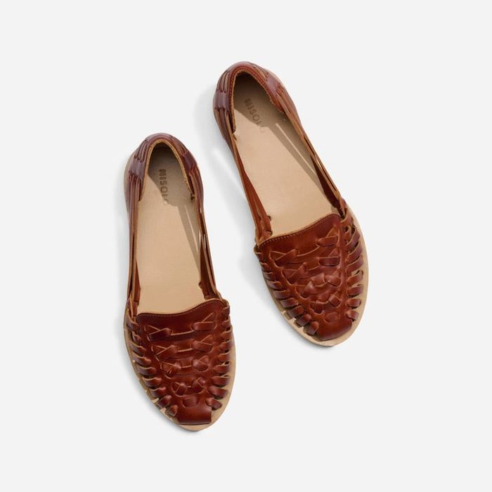 top view of a pair of woven leather flats