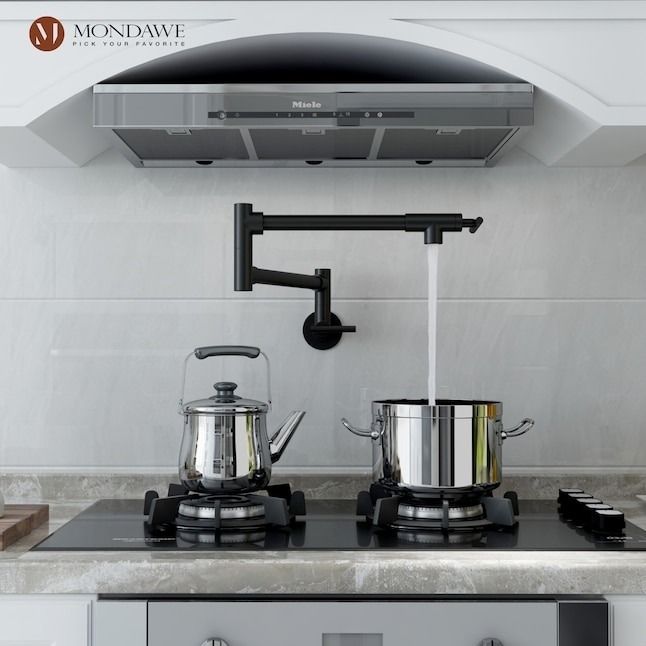 A pot filler faucet mounted on the wall, with water flowing directly into a pot
