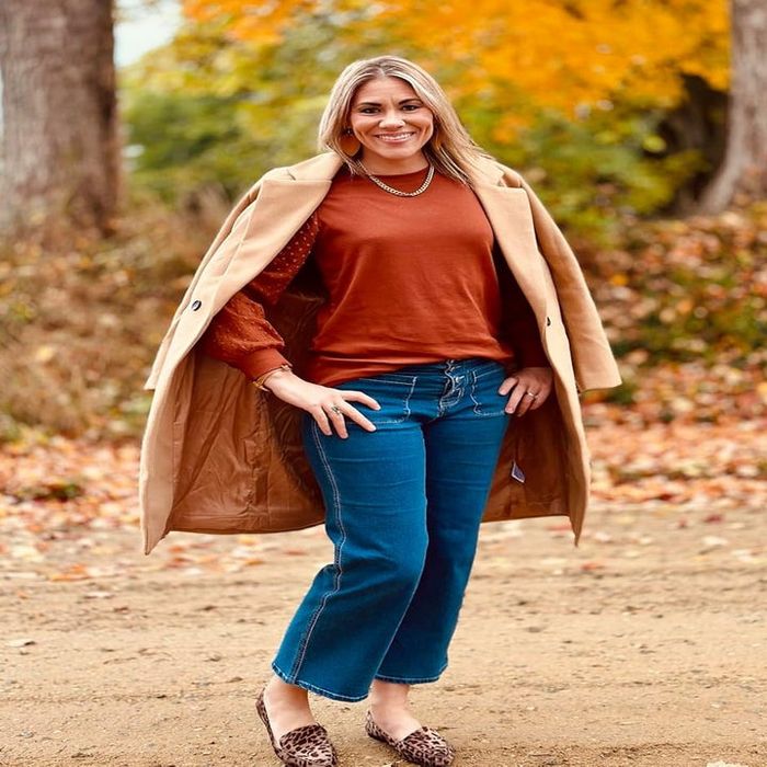 A reviewer modeling the khaki coat