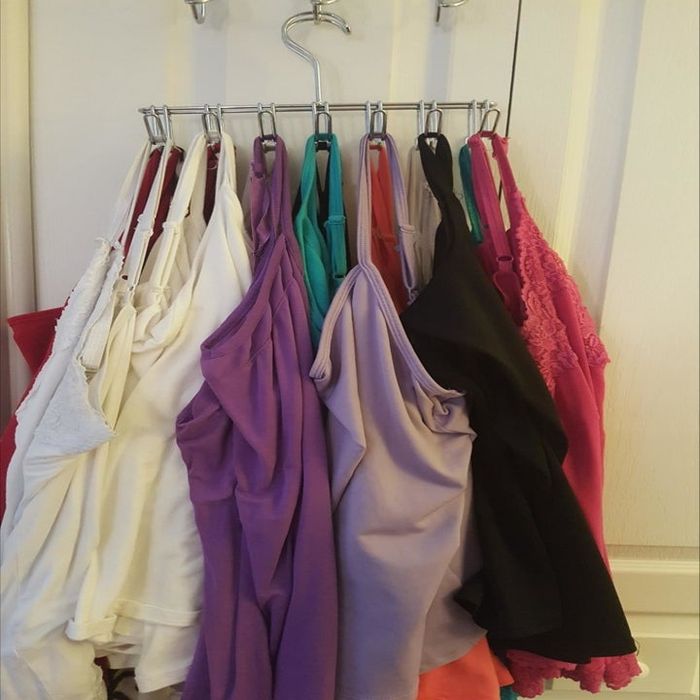 Tank tops neatly hung on hangers